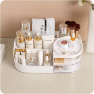 White rotating makeup organizer with multiple clear compartments displaying skincare bottles, cosmetics, and beauty tools on bathroom counter